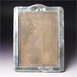 Silver upright photograph frame of plain design, aperture size 21cm x 15cm marks rubbed