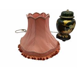 Table lamp in the form of a ginger jar and cover, decorated in gilt with butterflies and flowers upon a merging green ground, together with another similarly decorated example of baluster form, each with pink silk shades, first example base H29cm