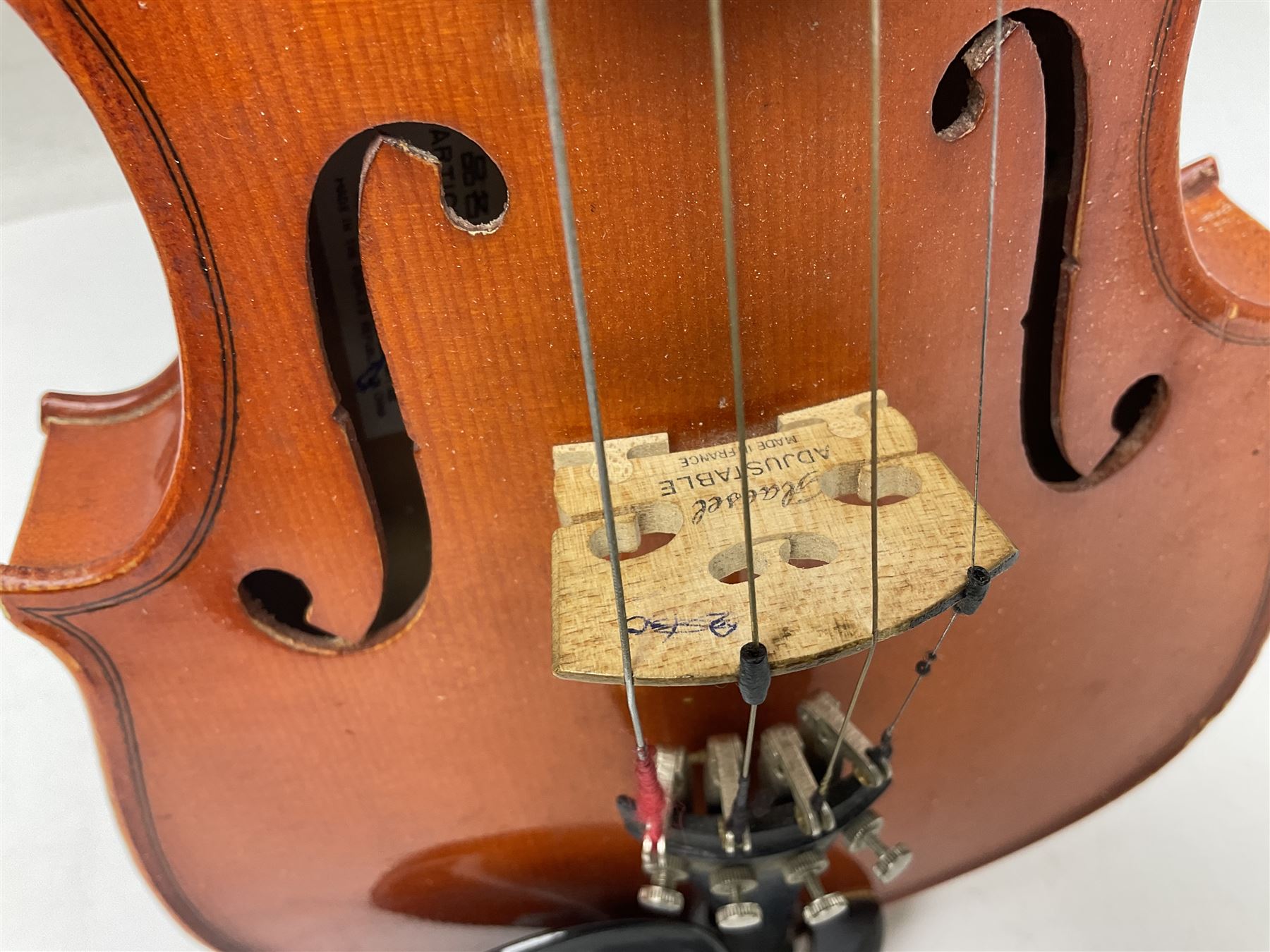 Four student violins - two Chinese three-quarter size with 33.5cm and 34cm two-piece backs; Stringers of Edinburgh quarter size with 28cm two-piece back; and Stentor quarter size with 28cm two-piece back; each in carrying case (4)