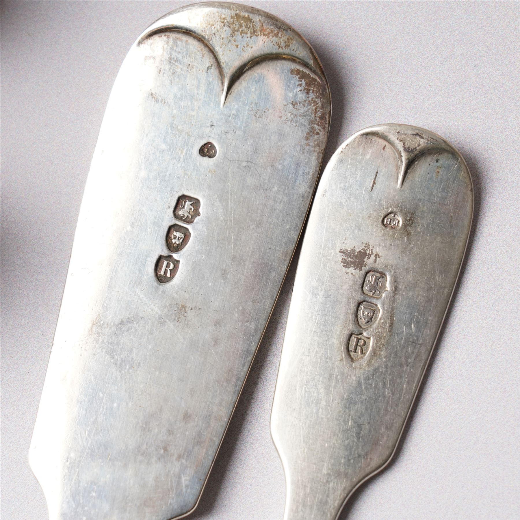 Silver Fiddle pattern canteen, composite, largely Victorian, comprising twelve table spoons, twelve table forks, twelve dessert spoons, eleven dessert forks, one soup ladle, one sauce ladle, and one serving spoon, each terminal engraved with The Everitt family Griffin crest, largely hallmarked Francis Higgins III, London 1892, soup and sauce ladle dated 1808 and 1828 

Provenance: From the collection of Andrew Chichester Everitt.



