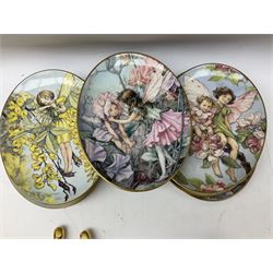 Royal Worcester Flower Fairies oval collectors plates, Goebel mustard pot, two Danbury Mint Fairy Tale bells, and pair of Hutschenreuther candlesticks decorated with scenes of Puss in Boots