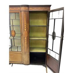 Edwardian inlaid mahogany display cabinet, projecting moulded cornice over frieze inlaid with bellflower and ribbon festoons, enclosed by two astragal glazed doors, on splayed square tapering supports
