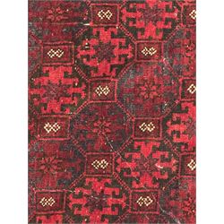 Turkoman red ground wool rug, the field with a repeating pattern of Tekke gul motifs in dark brown and red (195cm x 98cm); Afghan Bokhara red ground wool rug, central field with repeated geometric octagonal gul motifs, surrounded by multiple borders with stylised diamond and triangular patterns (127cm x 181cm)