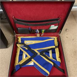 Masonic regalia, including sword, kid leather gloves and apron, Order of Holy Wisdom high priest mitre, etc, contained within briefcases and boxes 