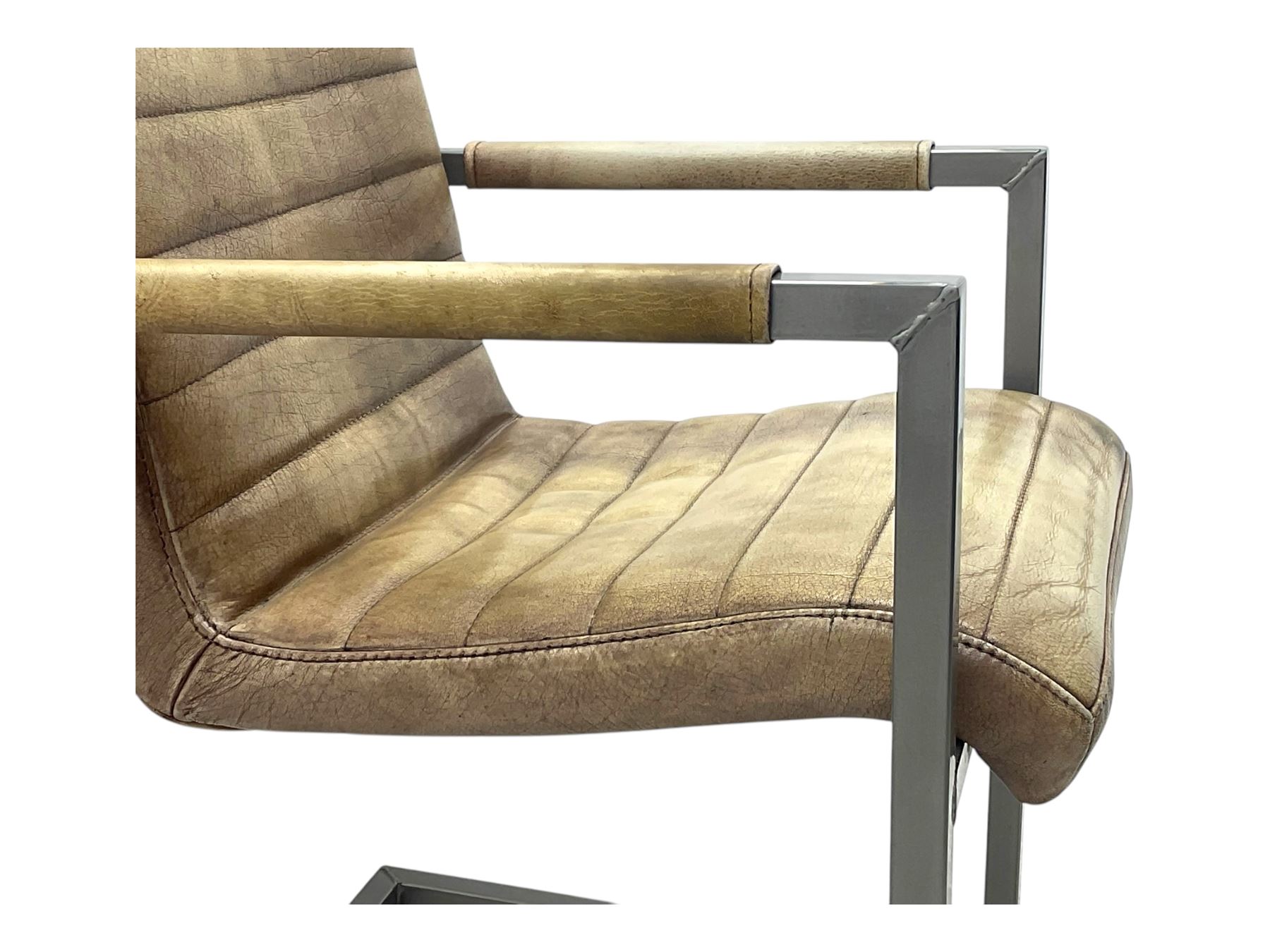 Pair of contemporary industrial style armchairs, each featuring a squared steel cantilever frame with upholstered arms, the seat and back finished in channel-stitched distressed tan faux leather