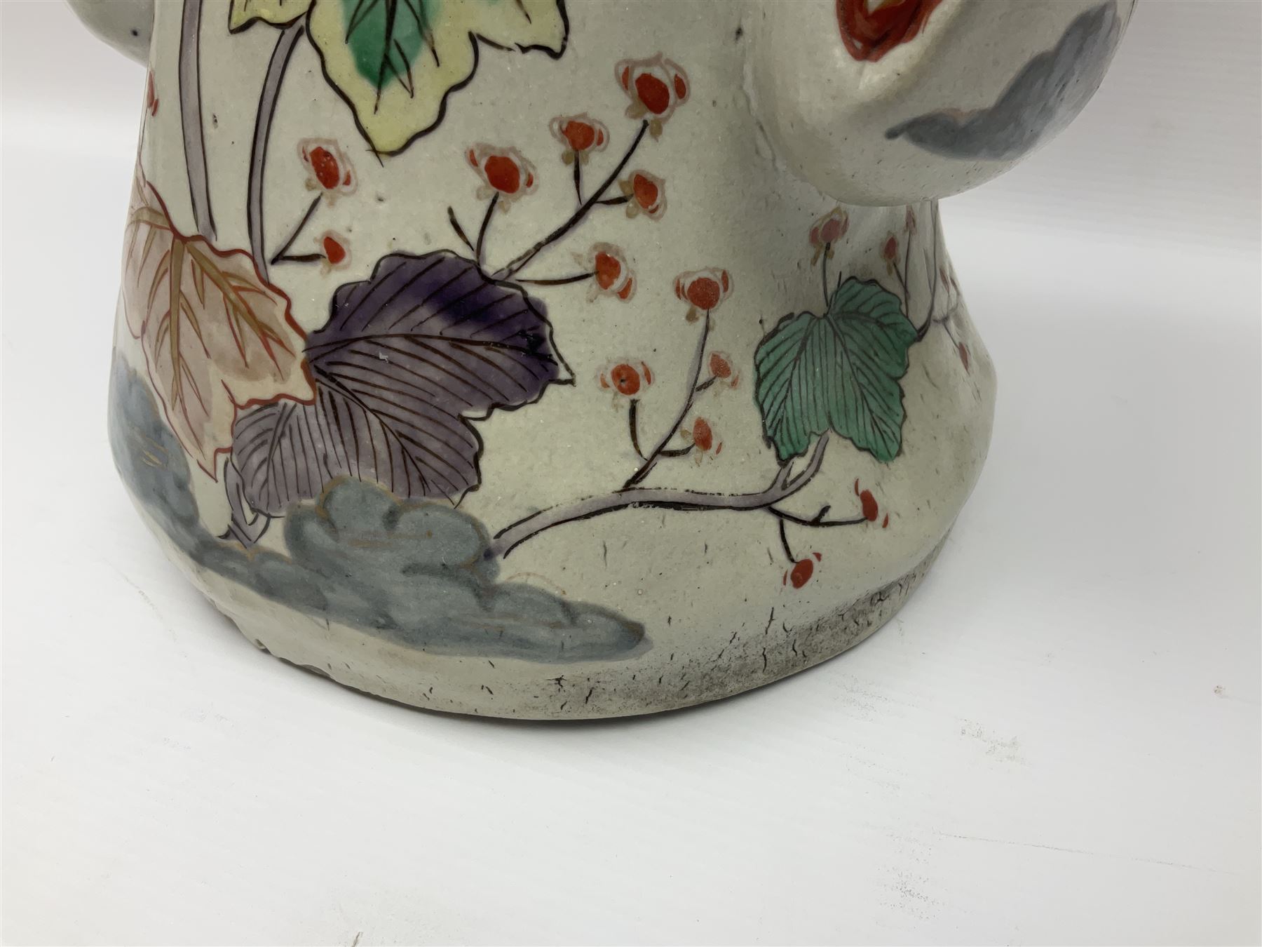 Large Japanese Imari porcelain figure, modelled as a Bijin, wearing a long kimono decorated with apple blossom and leafy branches on a white ground, with gilt detailing, possibly Edo period, H63cm