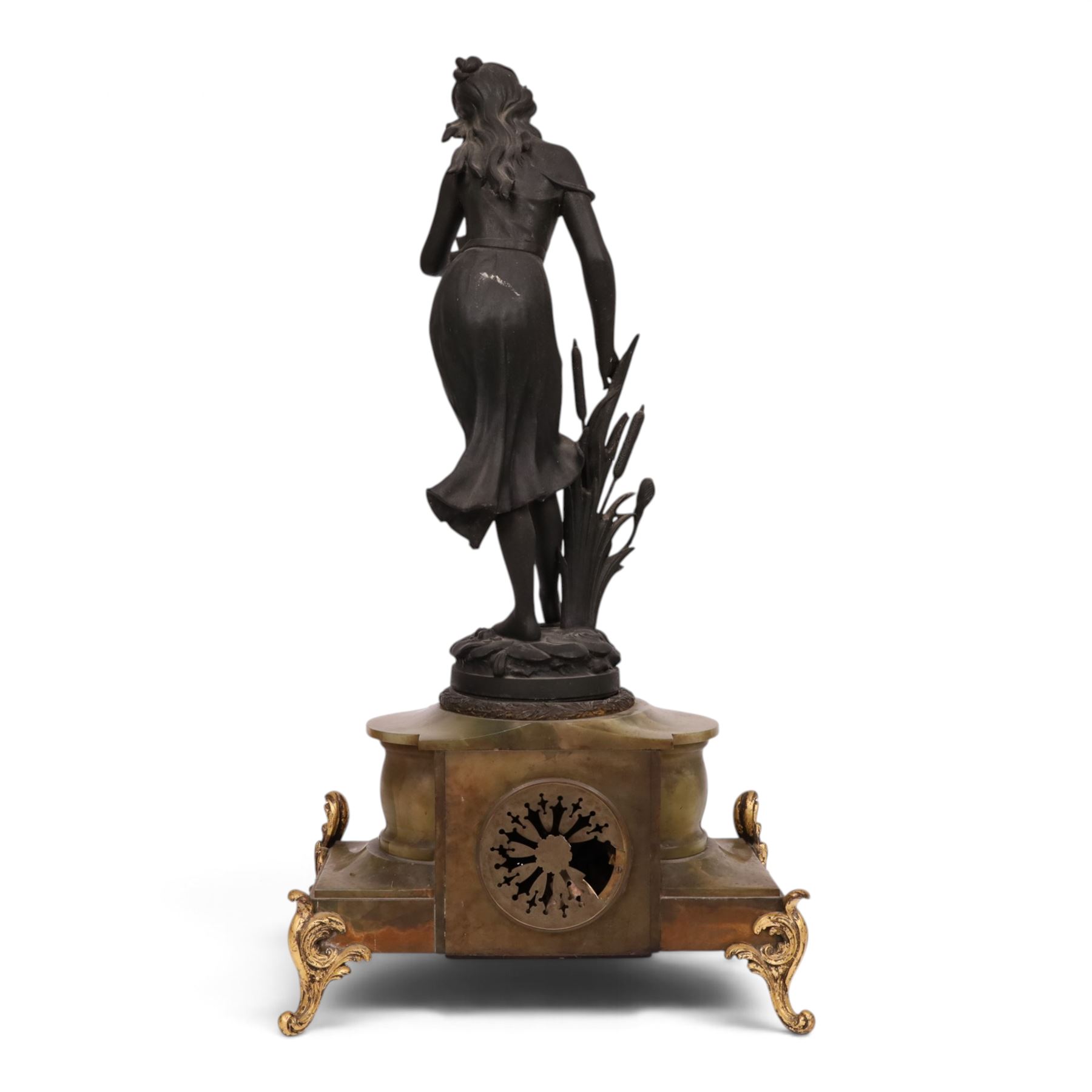 French green onyx clock, surmounted by a female figure amongst rushes, the enamel clock face with floral sprigs, H74cm 