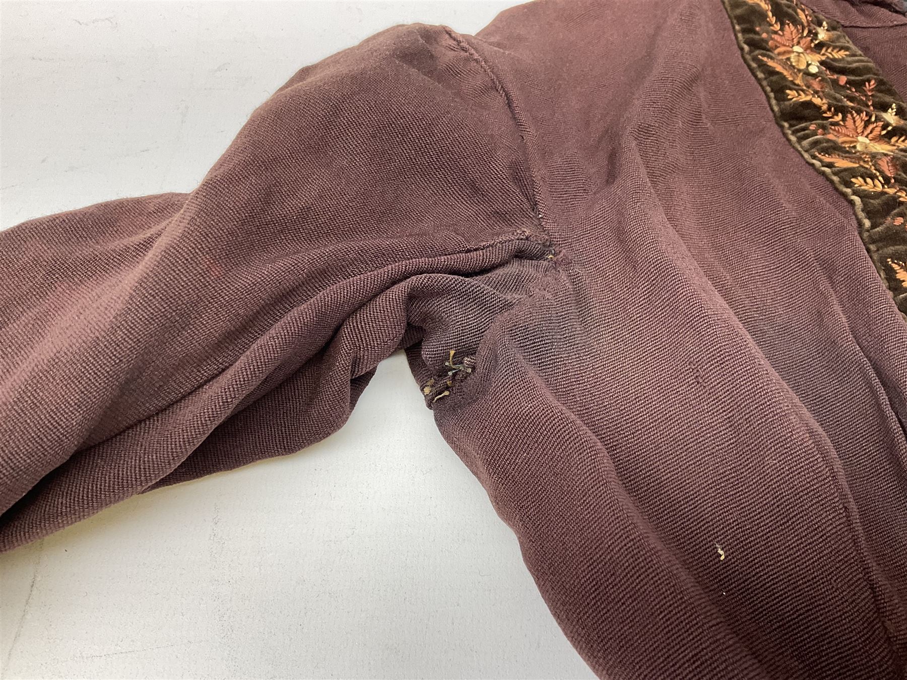 Victorian ladies riding habit, the two-piece construction in brown with embroidered floral velvet edging