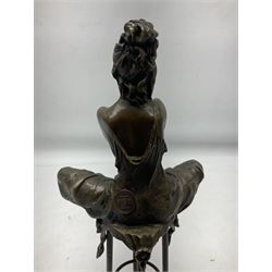 Art Deco style bronze modelled as a female figure seating crossed legged upon a chair, after Pierre Collinet, H28cm