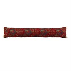 Long flatweave Kilim textile cushion, in crimson and decorated with geometric motifs and cotton fringe ends, 151cm, together with four modern hand-knotted rug mats with geometric designs, the largest 65x43cm, (5)