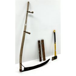 Early 20th century scythe (L155cm) an axe and two wooden levels 