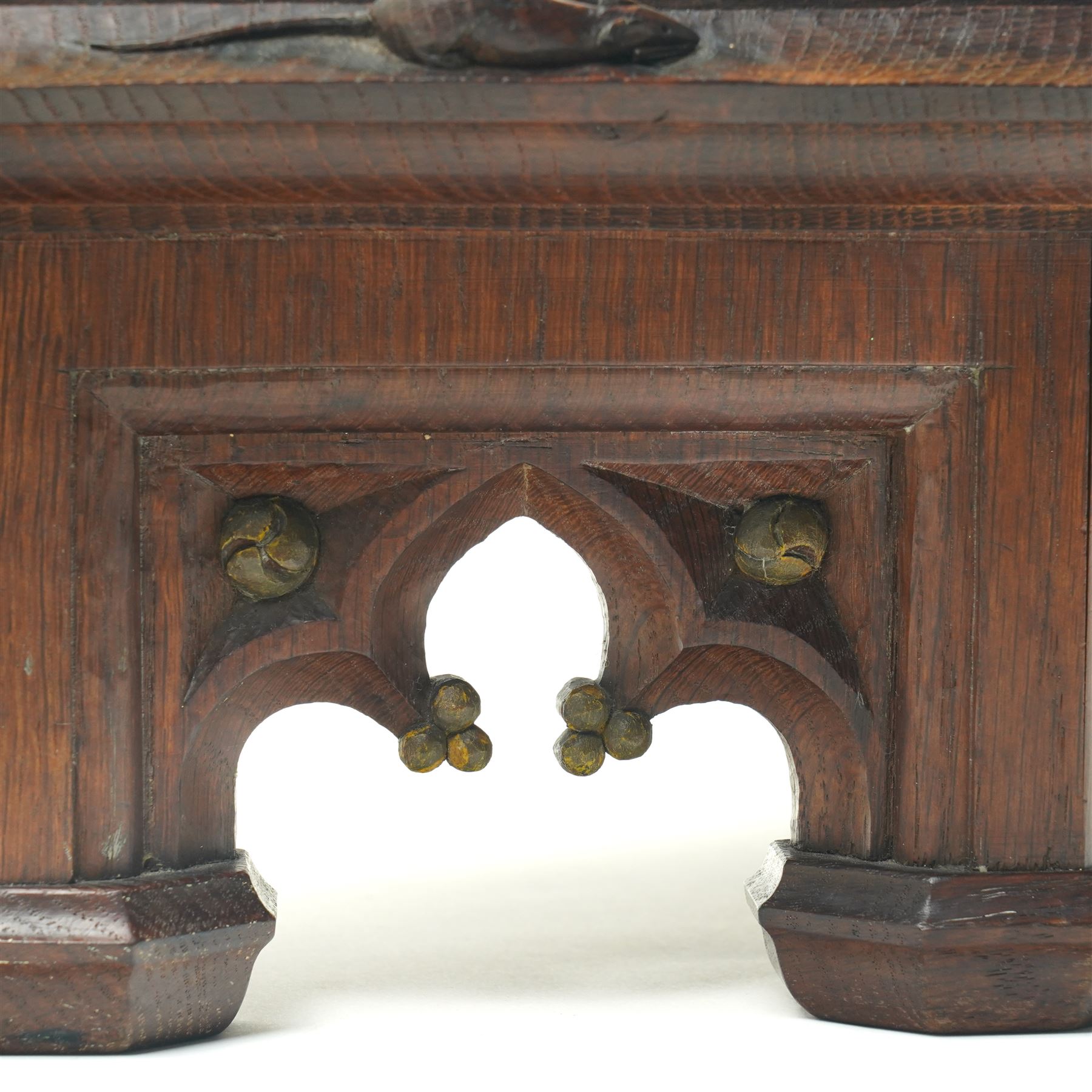 Mouseman - circa 1930s oak wedge shaped six sided plinth, of gothic design with carved berries and columnar supports, with carved mouse signature, by Robert Thompson of Kilburn