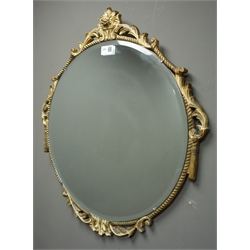  Circular ornate gilt framed bevel edged mirror (W53cm, H69cm) and an oval ornate gilt framed mirror  