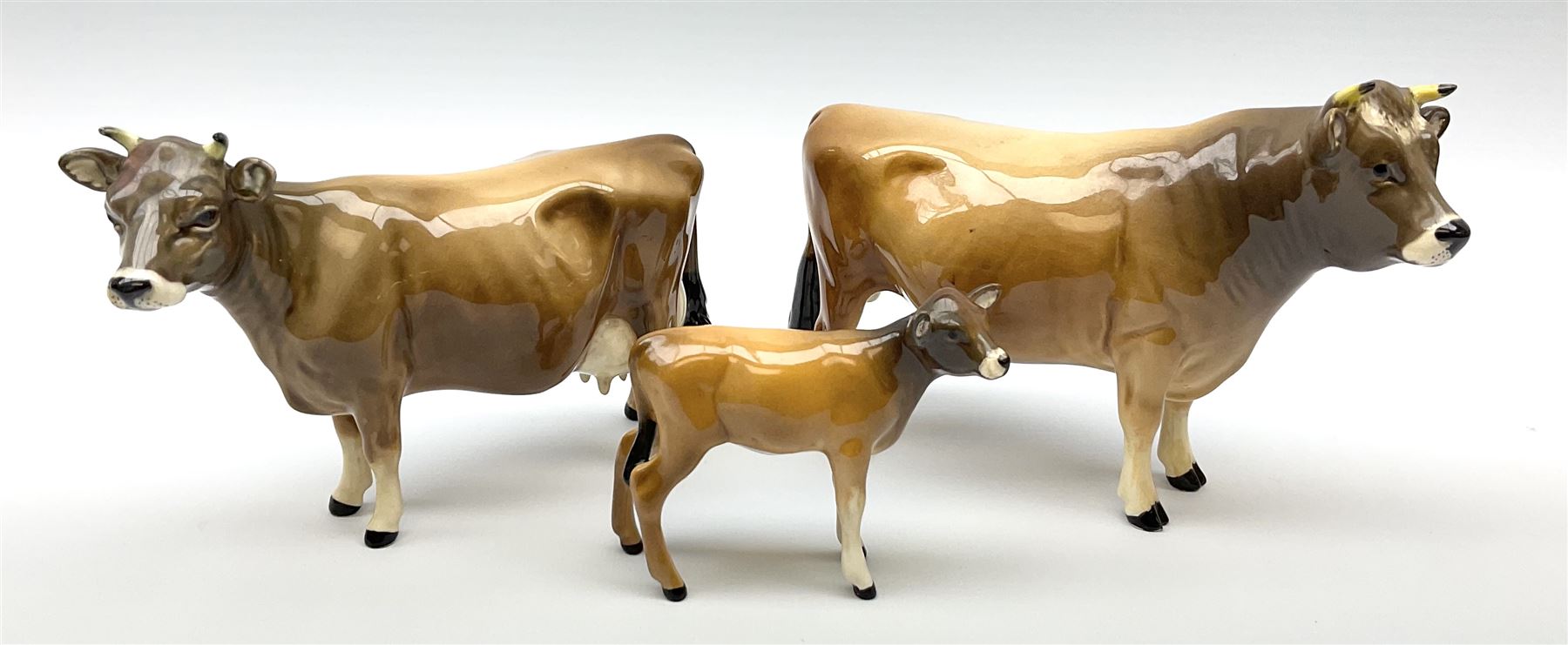 Beswick Jersey family group, comprising bull Dunsley Coy Boy model no 1422, cow Newton Tinkle model no 1345, and calf model no 1249d.