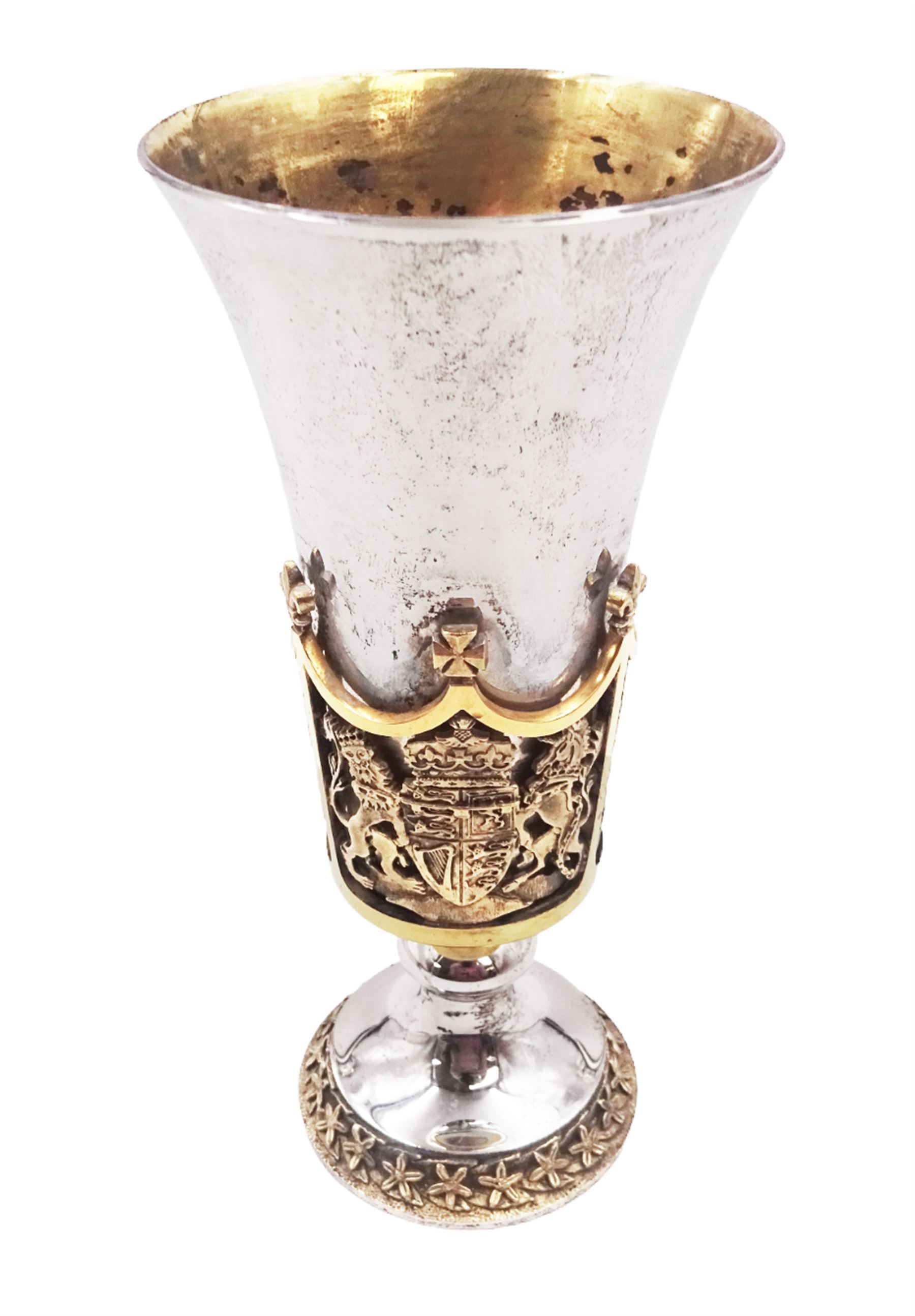 Modern limited edition silver Westminster Abbey Royal Wedding goblet, commemorating the marriage of HRH Prince Andrew and Miss Sarah Ferguson on the 23rd of July 1986, designed by Hector Miller for Aurum, the tapering cylindrical bowl with gilt interior and parcel gilt pierced band to base depicting the Royal Arms, upon knopped stem and circular stepped foot with floral parcel gilt rim, no. 483/750,  hallmarked Hector Miller, London 1986, H17cm