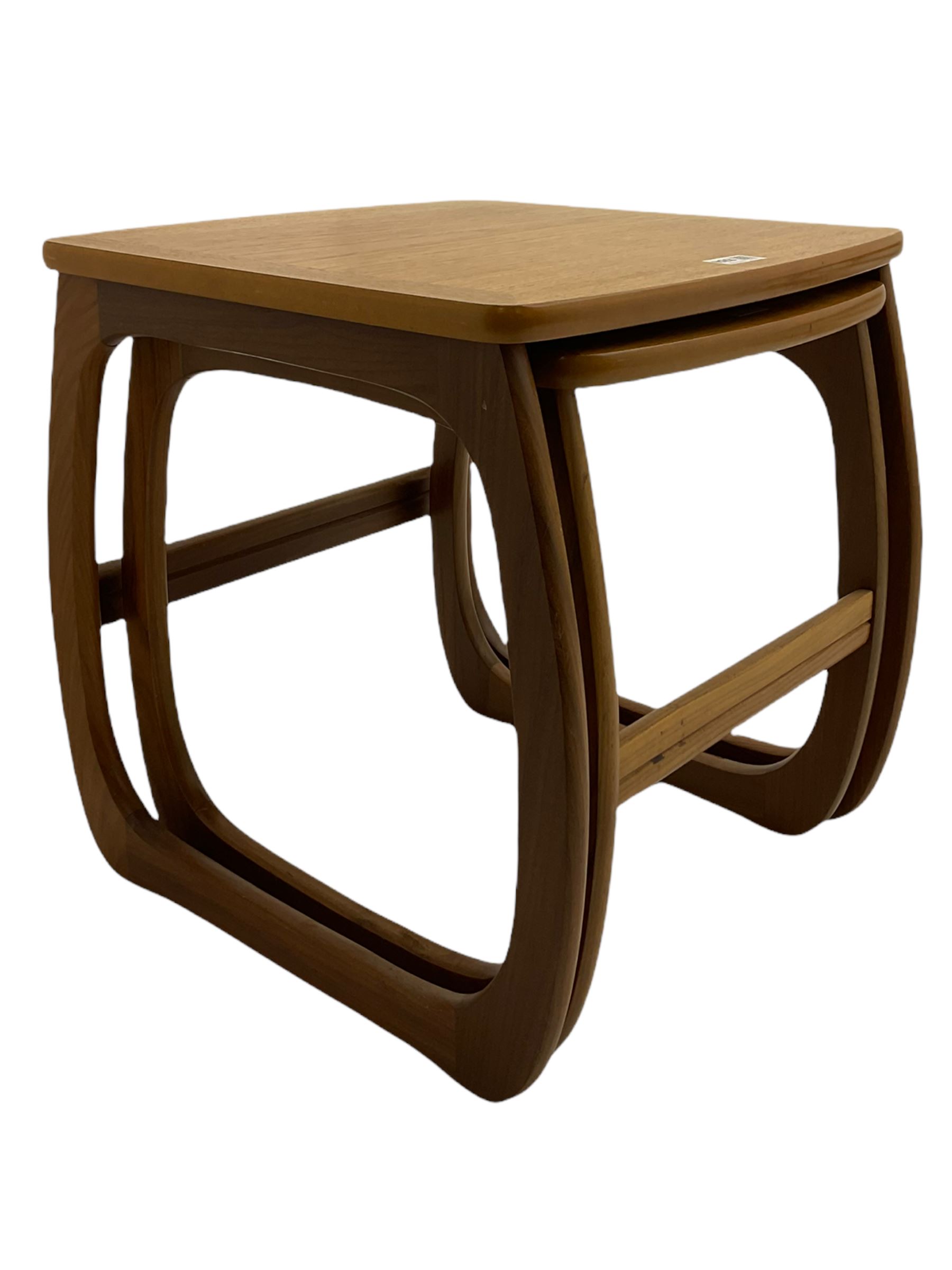 Nathan - teak Long John nest of tables and a singular nest of tables 