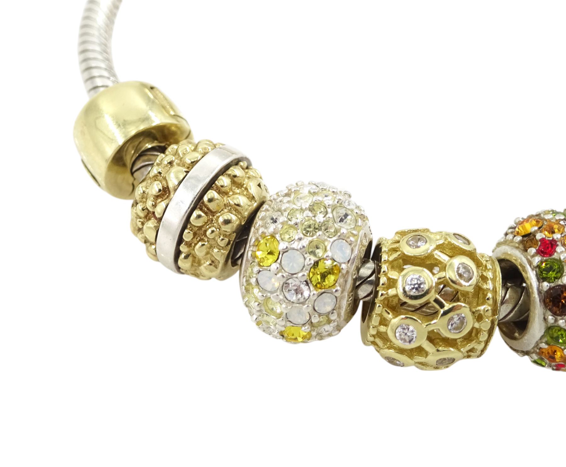 Chamilia 14ct gold and silver charm bracelet, silver bracelet, with 14ct gold and silver finials, six 14ct gold charms including cubic zirconia, four silver charms and two silver and 14ctgold charms, boxed