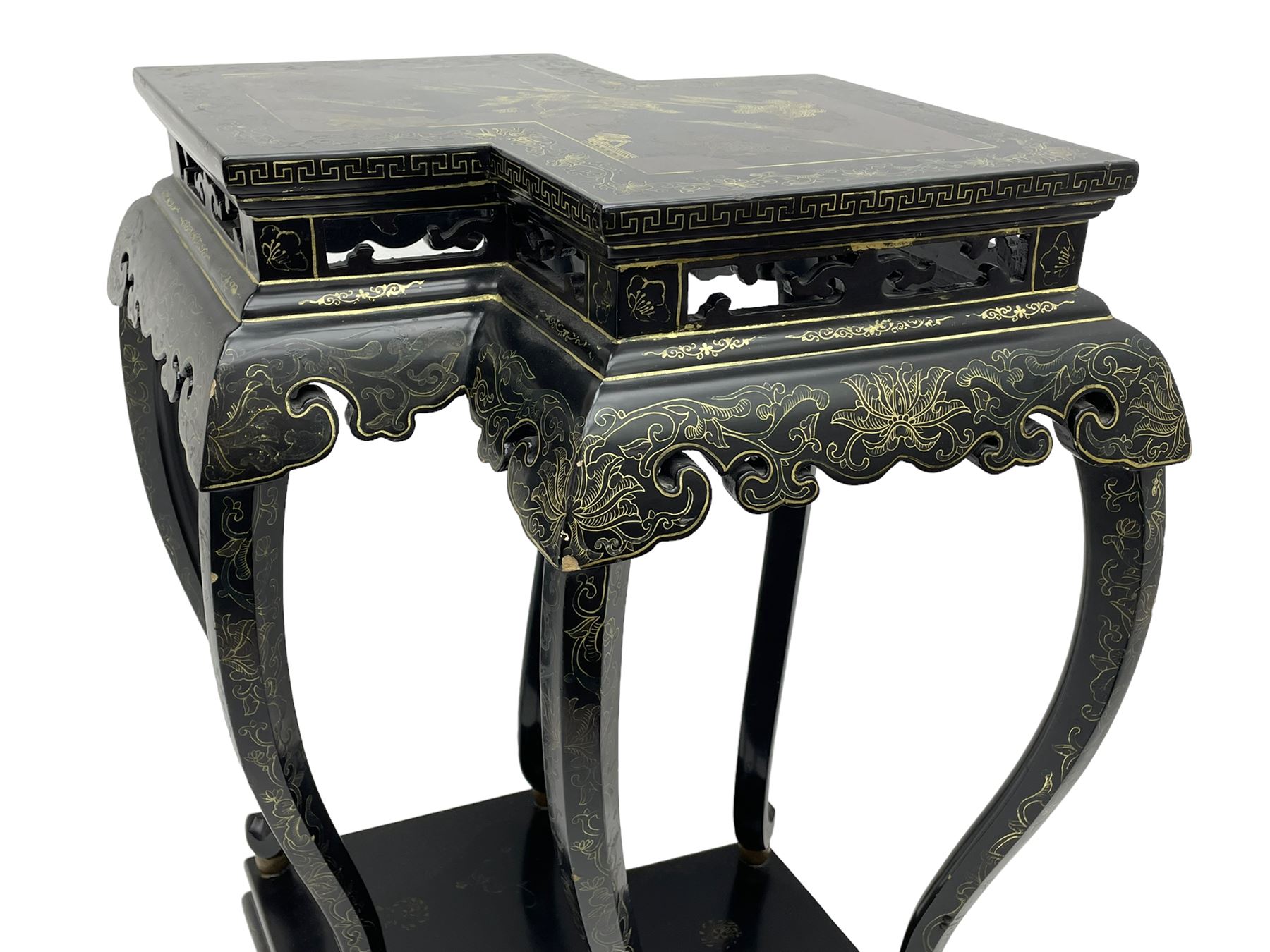 Chinese black lacquer double jardinière stand, the double-lozenge top painted with traditional landscape scenes within a gilt strung border, the pierced frieze with trailing foliate decoration and geometric patterns over the shaped projecting apron, supported on six cabriole supports united by a hexagonal undertier, raised on compressed spade feet