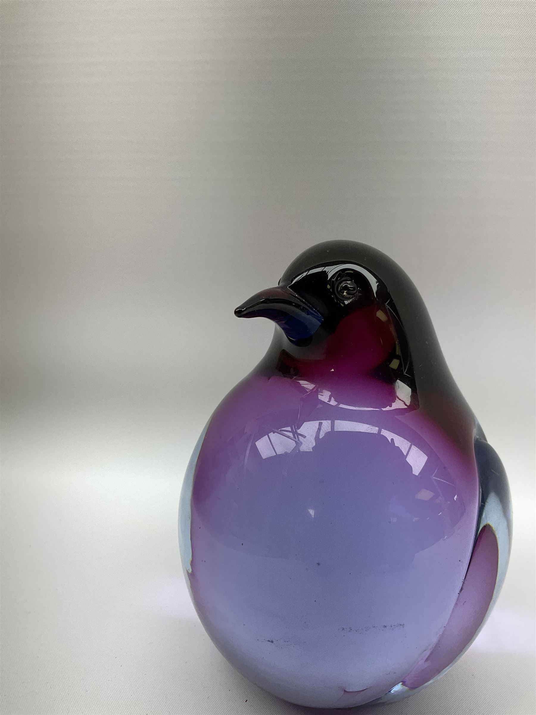 Livio Seguso (Italian, 1930-), Murano glass penguin paperweight in purple and blue, H12.5cm, together with another paperweight modelled as a polar bear for Graglas of Germany, c1970, both with etched marks beneath