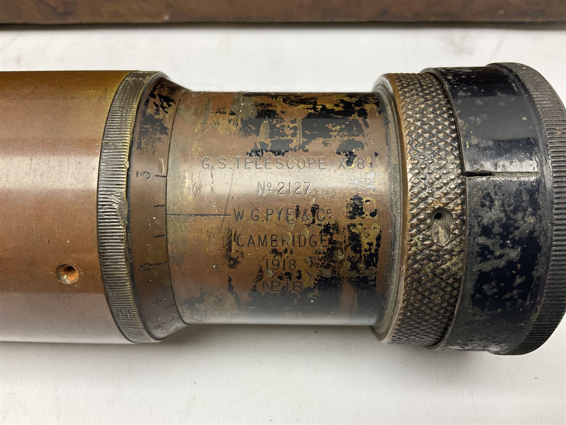 Early 20th century brass and black japanned gunsighting telescope inscribed 'G.S. Telescope X8 No.2127 W.G. Pye & Co Cambridge 1918 No.18' with X graticule to lens L53cm; in wooden box marked 'Gunsighting Telescope'