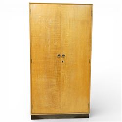 Mid 20th century oak veneered wardrobe, the plain rectangular top above a pair of hinged d...