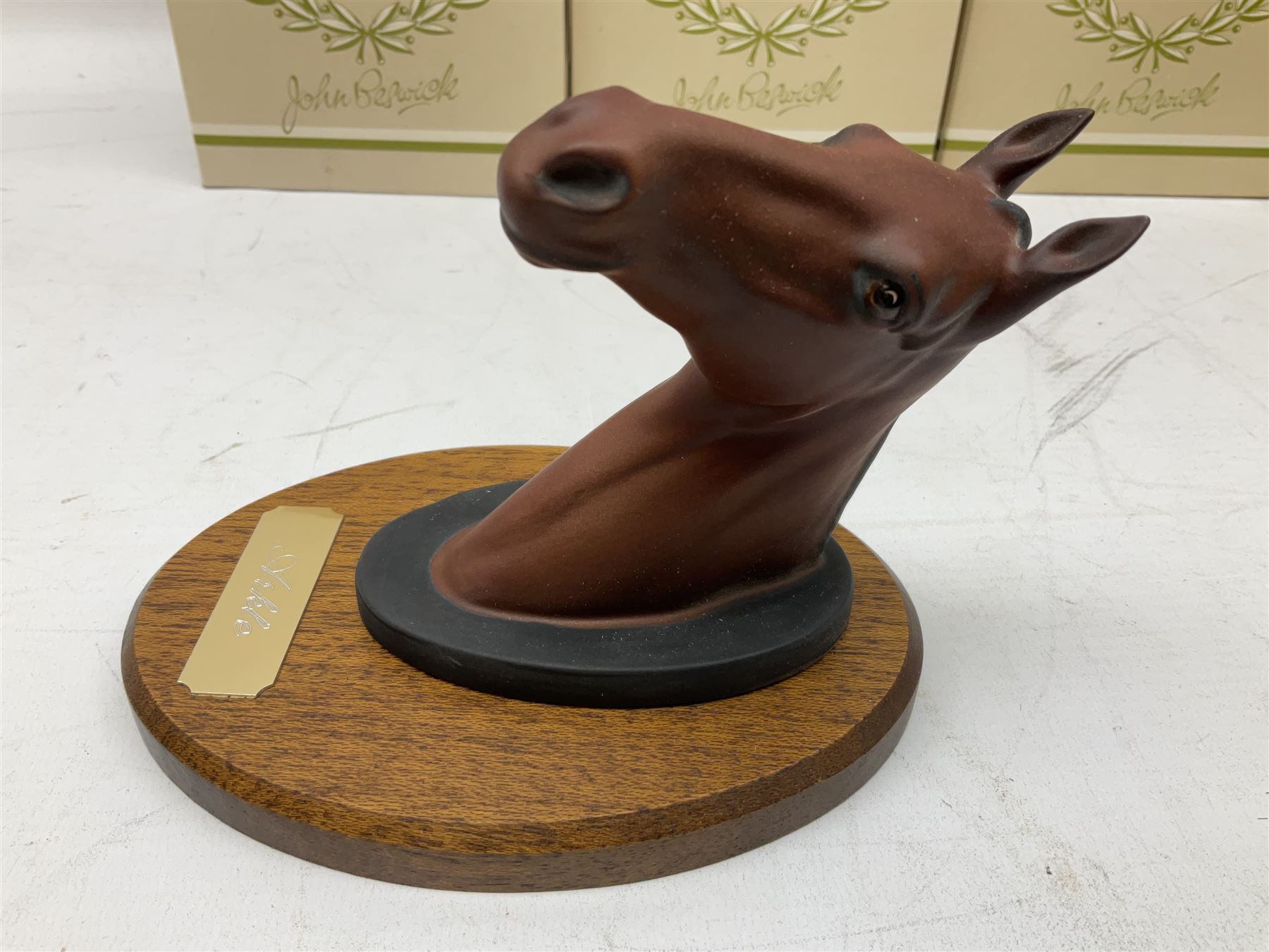 Beswick set of horse head wall plaques 'Champions all', comprising Arkle no.2700, The Minstrel no.2701, Red Rum no.2702, Troy no.2699, all with original boxes
