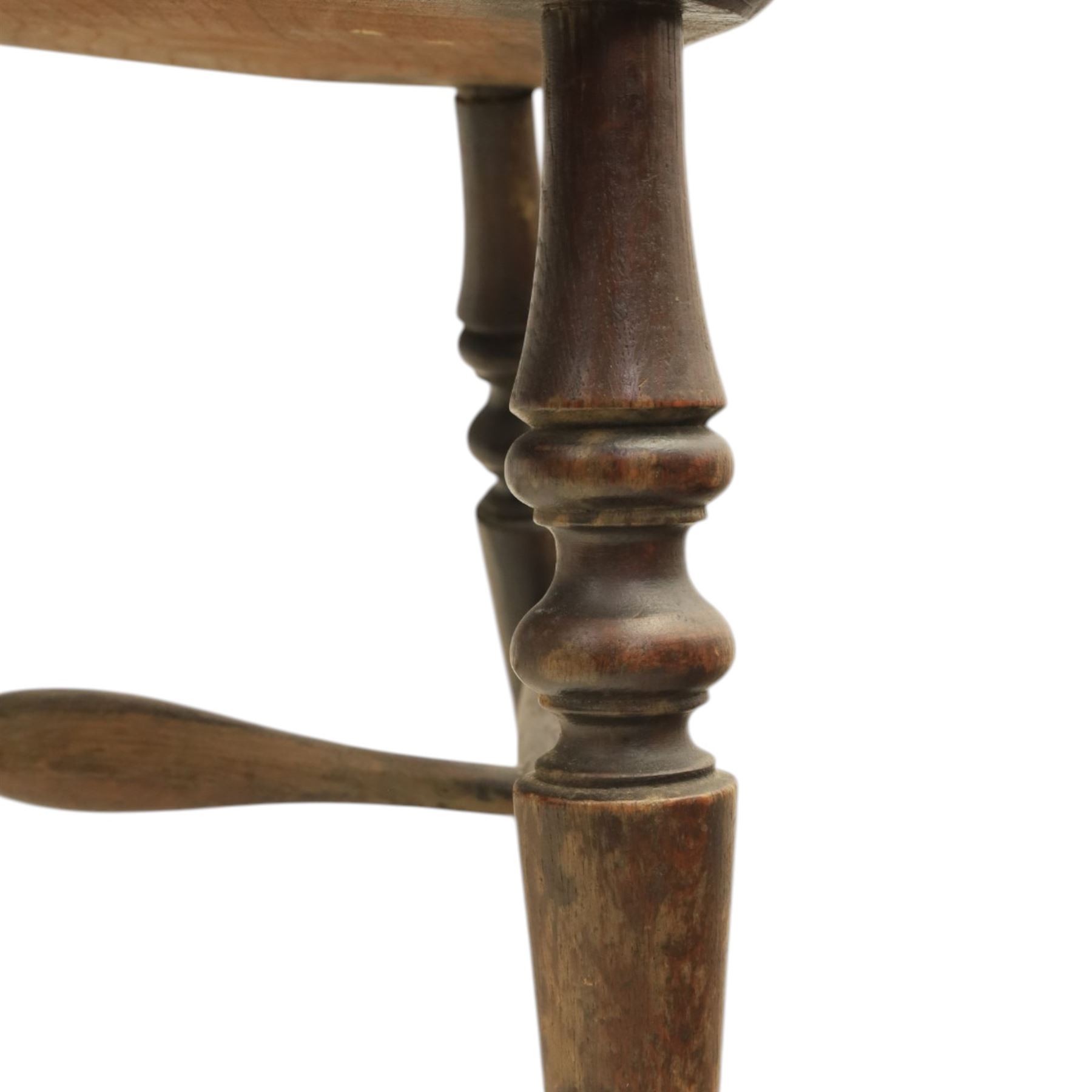 Early 20th century elm smoker's bow or captain's chair, elm dished seat raised on turned supports