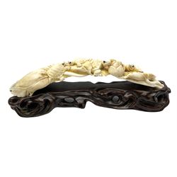 Japanese Meiji period carved ivory okimono figure group, modelled as four terrapins with inset eyes upon a flowering and curled leaf, signed with character mark beneath, upon a separate carved hardwood stand, okimono L17cm