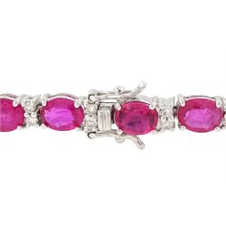 18ct white gold ruby and diamond bracelet, twenty-six oval cut rubies, each spaced by two round brilliant cut diamonds, hallmarked, total ruby weight approx 9.40 carat, total diamond weight 0.50 carat