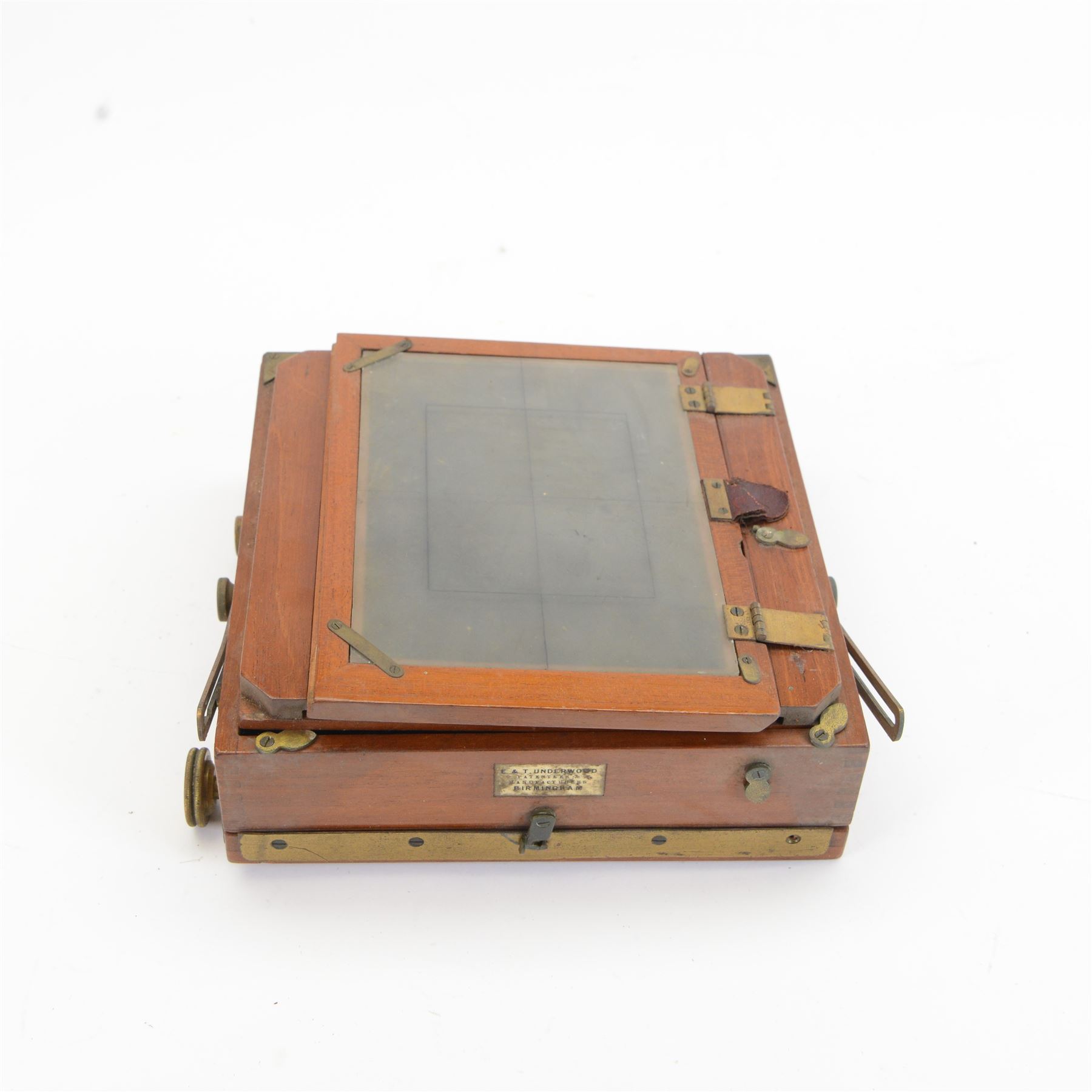 UNABLE TO SELL Two mahogany and brass half plate cameras, comprising E & T Underwood camera and a Taylor's Drug Co. Ltd 'The Albion' camera, each with Thornton Pickard 'Snap Shot' lenses, all with ivory maker's plaques, with a glass plate and a canvas carry case