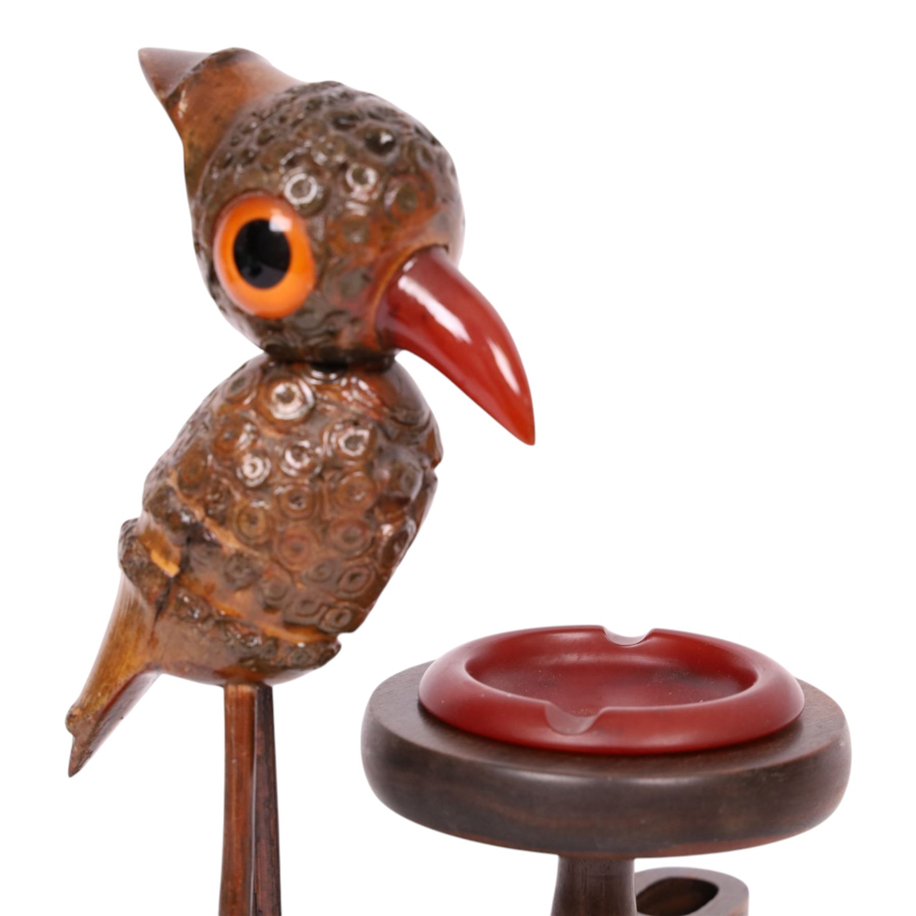 Henry Howell & Co., YZ bird novelty smokers stand, circa 1920-30's, with novelty nut bird with Bakelite beak and tail, with removable Bakelite ashtray on raised wooden plinth, with match holder and striker to the base, stamped YZ TRADE MARK MADE IN ENGLAND to base, 23cm, L21cm  