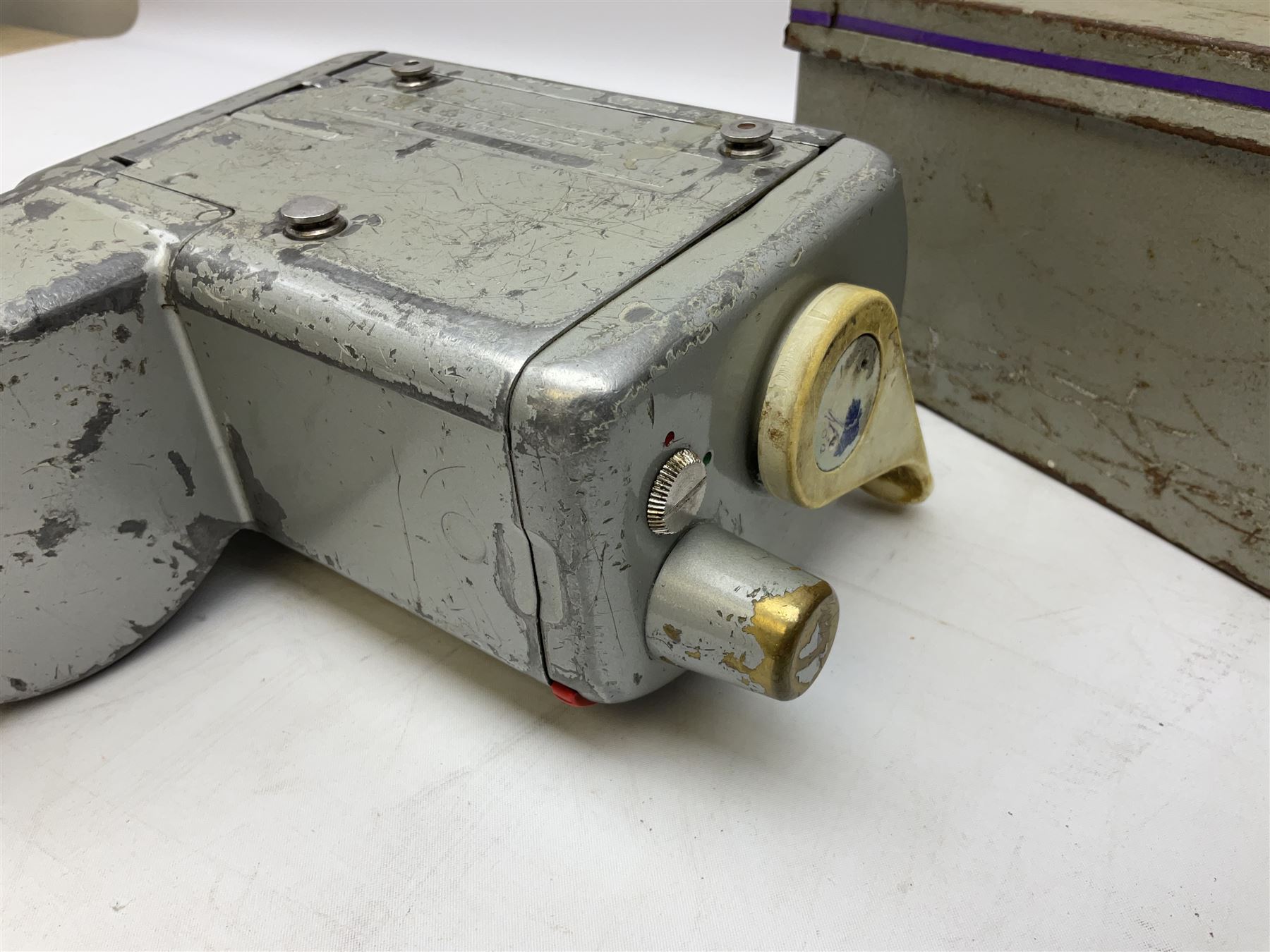 Bell Punch Company of London 'The Ultimate' five lever fare collection machine, together with an Almex ticket machine with shoulder strap, two brass Halifax transport cap badges, other chrome tramway cap badges, etc