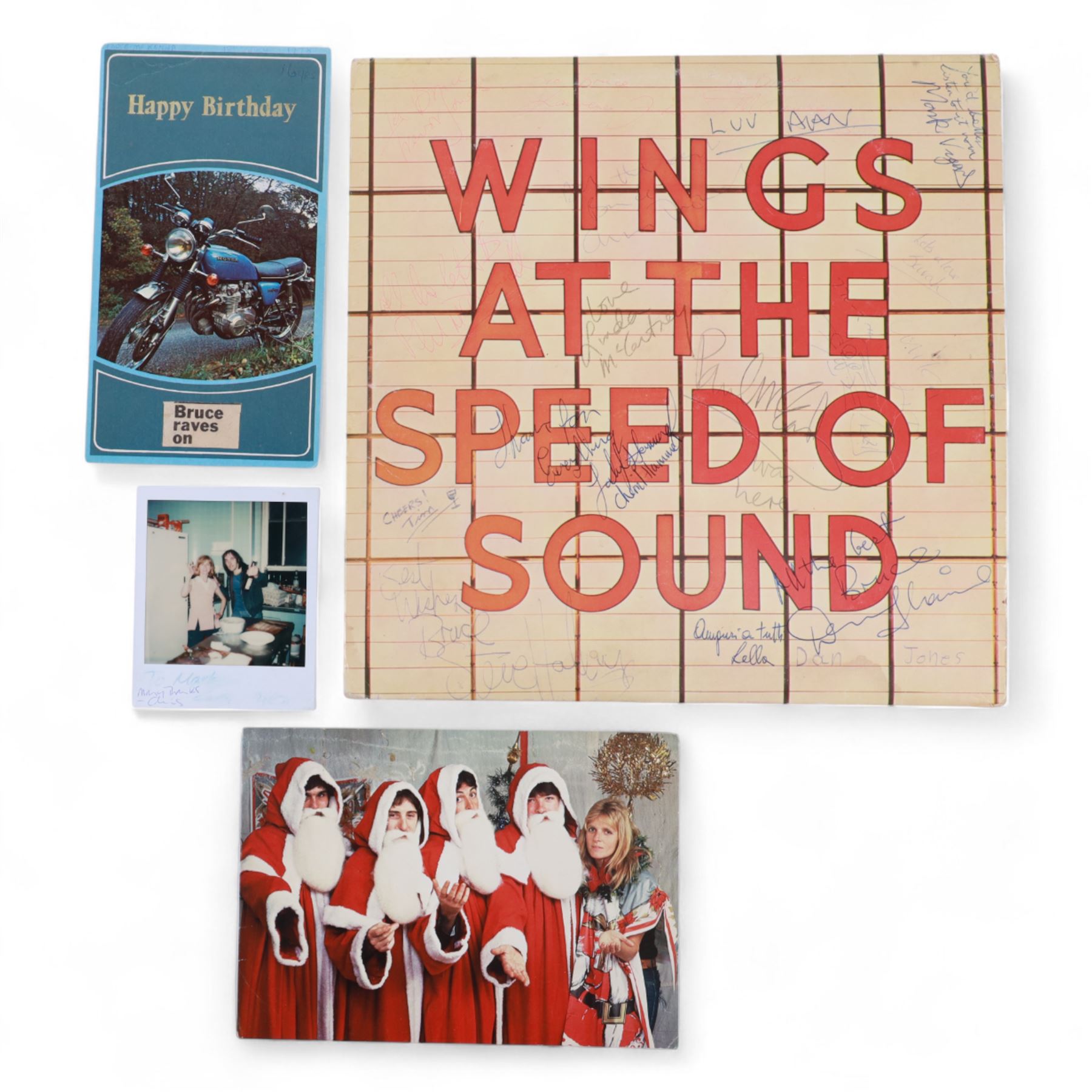 Wings at the Speed of Sound, signed vinyl, Christmas card and birthday card, the vinyl with multiple signatures, including Paul McCartney, Linda McCartney, Denny Laine, Trevor Jones and Laurence Juber, the Birthday card depicting motorbike with a note to the front written in pen reading  'Bruce McKenna 18th July 1978 16yrs', signed to the interior with personal messages including 'All the breast Bruce, Paul McCartney', 'Happy Xmas (with cross through), Happy birthday Bruce Denny Laine', 'Merry Xmas Love Linda McCartney', 'Happy birthday, Laurence Juber', etc, the christmas card showing the five band members dressed as Santa Clause, with one unidentified signature inside

Notes: the vendors lived in Canada in the early 1980s and rented out their house on their return to England. The couple who rented the house had just sold a hotel in Vancouver in which Wings had stayed, and they left the record and cards behind.