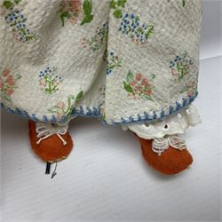 Anna Meszaros Hungary - three hand made needlewrok figurines - each wearing a lon floral dress and bonnet and holding a bouquet of flowers, tallest H32cm (3)  Auctioneer's Note: Anna Meszaros came to England from her native Hungary in 1959 to marry an English businessman she met while demonstrating her art at the 1958 Brussels Exhibition. Shortly before she left for England she was awarded the title of Folk Artist Master by the Hungarian Government. Anna was a gifted painter of mainly portraits and sculptress before starting to make her figurines which are completely hand made and unique, each with a character and expression of its own. The hands, feet and face are sculptured by layering the material and pulling the features into place with needle and thread. She died in Hull in 1998.