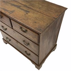 Small Georgian oak chest, fitted with two short and two long drawers, on bracket feet