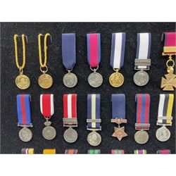 Two limited edition large framed display boards with half-size copies of British Gallantry and Campaign Medals produced by Danbury Mint and entitled 'For Valour'. Sixty medals on each board, all with ribbons. Complete with Danbury Mint certificate serial number A0148 and other paperwork.