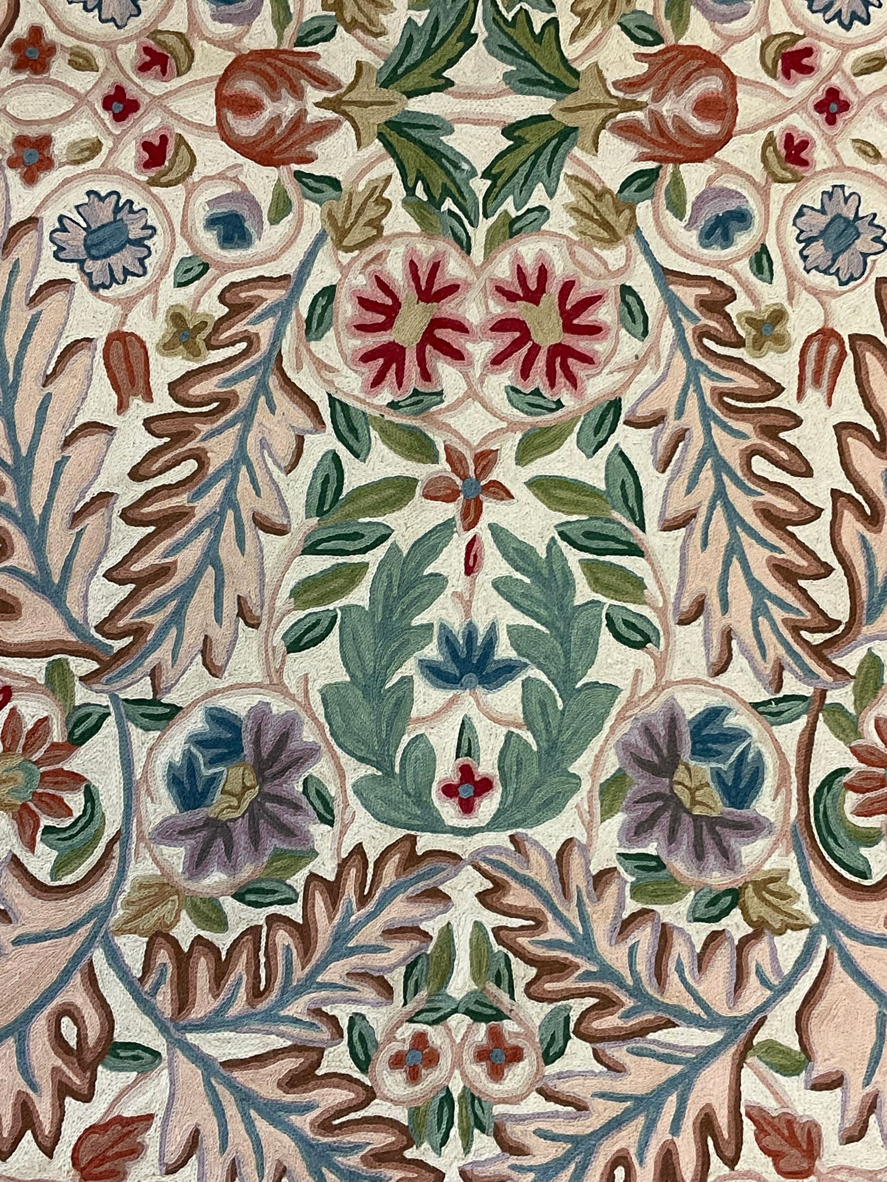 Crewel work wool chain wall hanging or rug, decorated with leaves and flower heads, the border with trailing floral pattern