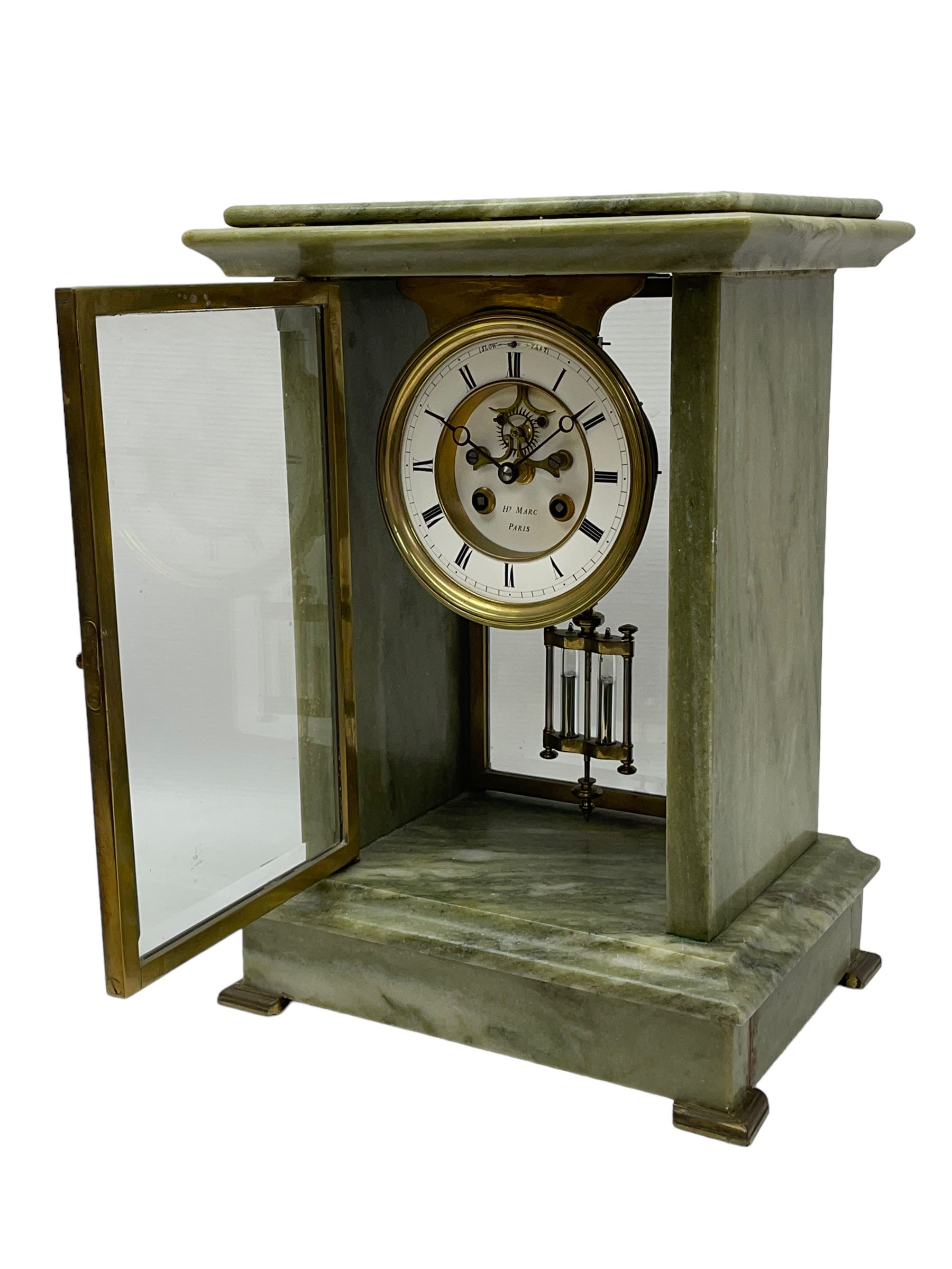Henry Marc - Early 20th century 8-day French art deco mantle clock c1910, in a green mottled marble case with a stepped flat top and deep moulded plinth, brass framed bevelled front and rear glass doors, two part enamel dial with a visible Brocot deadbeat escapement and pendulum regulation, steel moon hands and Roman numerals, Parisian twin train rack striking movement with a visible twin file mercury pendulum, striking the hours and half-hours on a bell.
