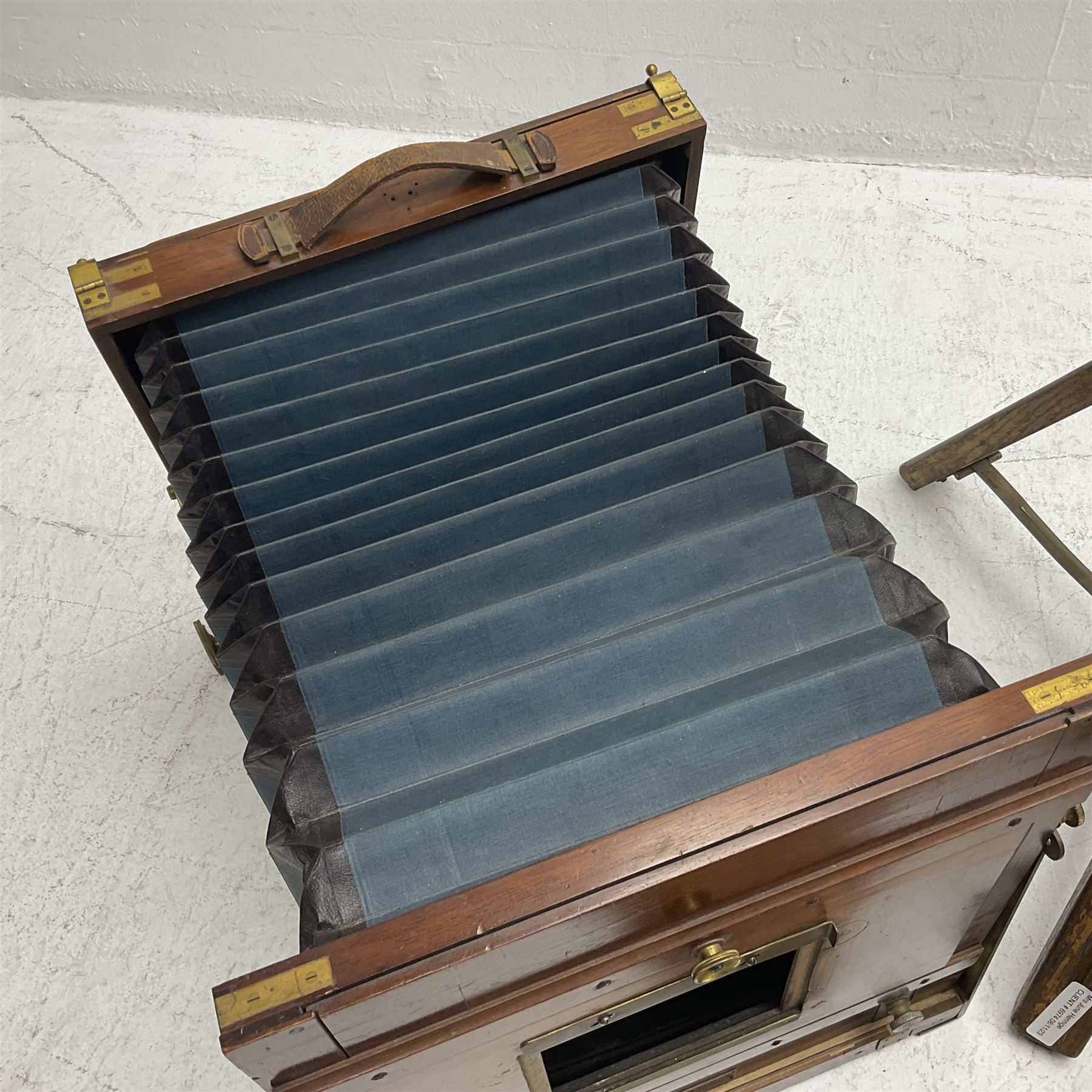 Kieser & Pfeufer folding mahogany and brass full plate camera, with adjustable wooden tripod