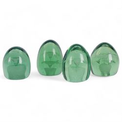 Four Victorian green glass dump paperweights with floral sulphur inclusions, tallest H12cm