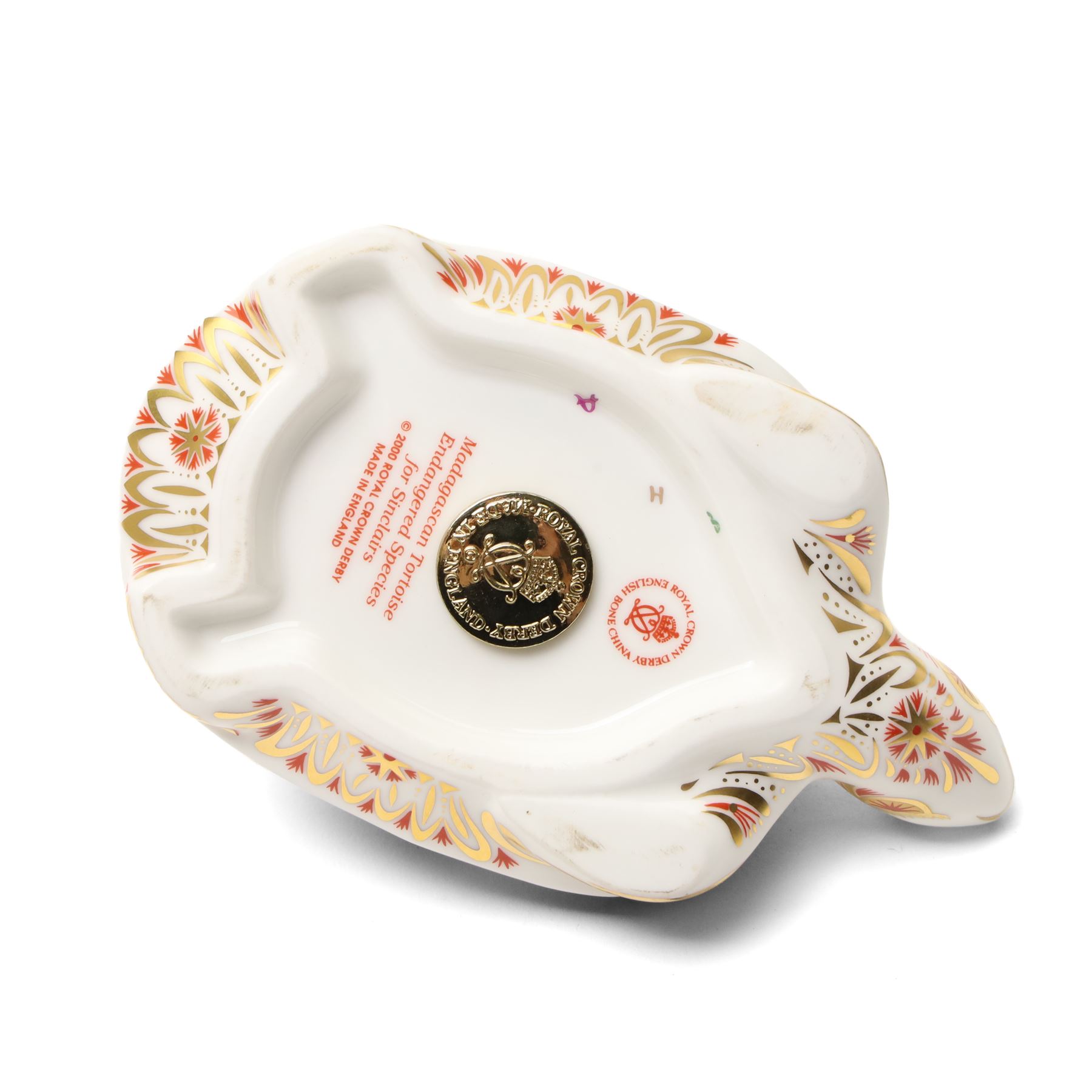 Royal Crown Derby paperweights, Galapagos Penguin limited edition 177/1000 and Madagascan Tortoise 177/1000, both from the Endangered Species series with gold stoppers and certificates