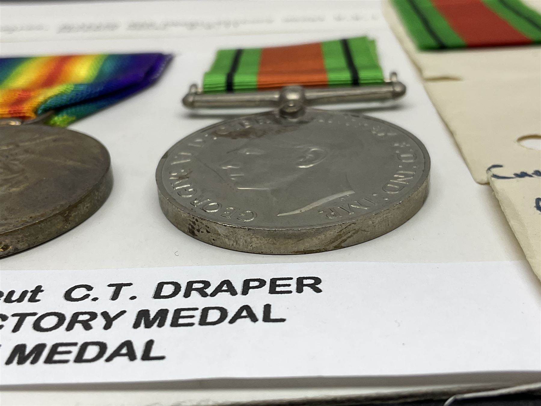WWI pair of medals comprising British War Medal and Victory Medal awarded to 2nd Lieutenant C.T. Draper; and WWII Defence Medal awarded to Captain C.T. Draper with War Office letter of confirmation; all with ribbons (3)