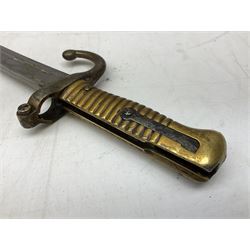 French Model 1866 sabre bayonet with 57cm fullered steel curving blade; in steel scabbard L71cm overall; another Model 1866 sabre bayonet lacking scabbard; and British Pattern 1856 sword bayonet (no scabbard) (3)