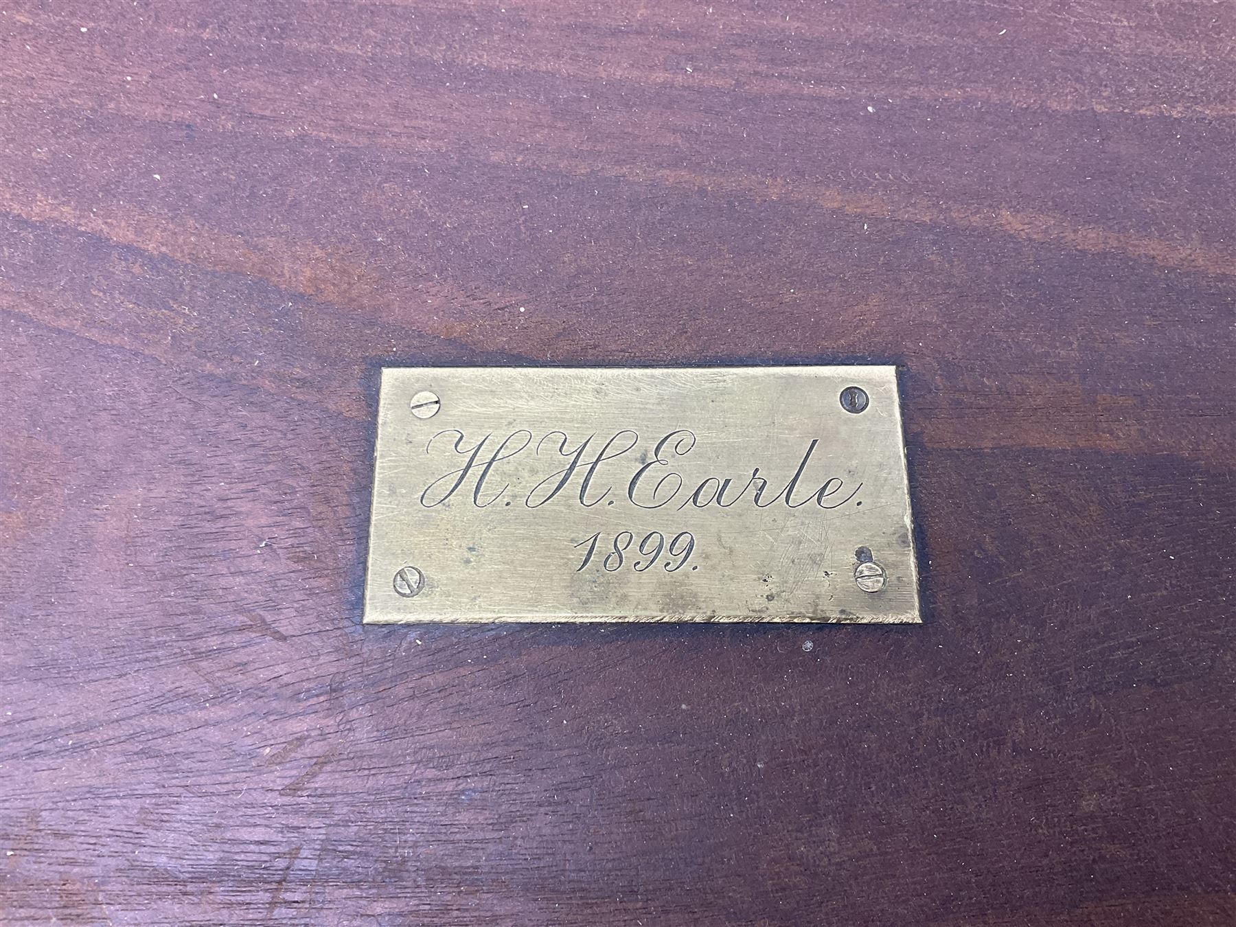 19th century teak chest, with sunken brass handle, the hinged lid with brass plaque engraved 'H.H. Earle 1899', H34cm, L83cm, notes: reputedly the chest of H.H.Earle, daughter of George F Earle of the Earle shipbuilding family of Hull 