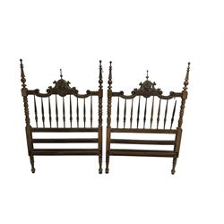 Pair Spanish stained beech single 3' bedsteads, spindle turned backs and carved with scrolling floral decoration 
