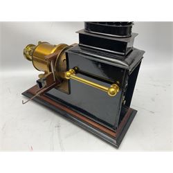 French magic lantern, in brass and black japanned tin case with carrying handles, four adjustable burners and height adjuster, on stepped wooden base L47cm