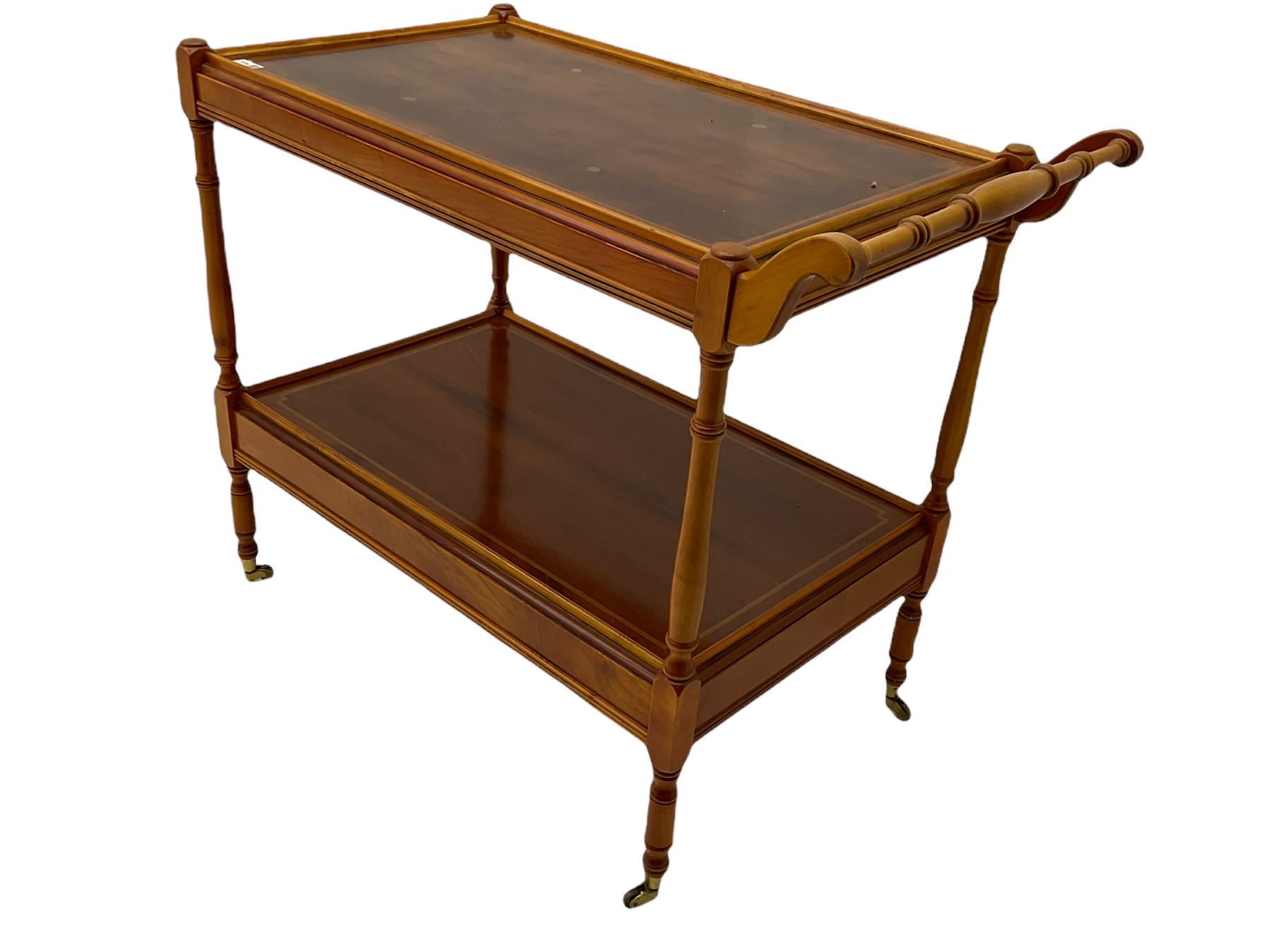 Yew wood drinks trolley, rectangular form with leather inset slide and turned handle, the undertier fitted with drawer, turned supports and brass castors