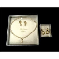 Pair of Christian Dior clip on hoop earrings, stamped Chr.Dior, together with a faux pearl necklace and similar clip on earrings, stamped Grosse, both within Christian Dior boxes