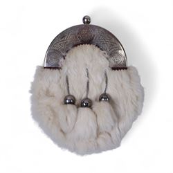 Piping regalia, comprising Armstrong tartan kilt with two kilt pins, three sporrans, including fur example, two jackets, Glengarry hat, other hats, collection of shirts, socks, ties, Hecsan shoes, dirk and belt