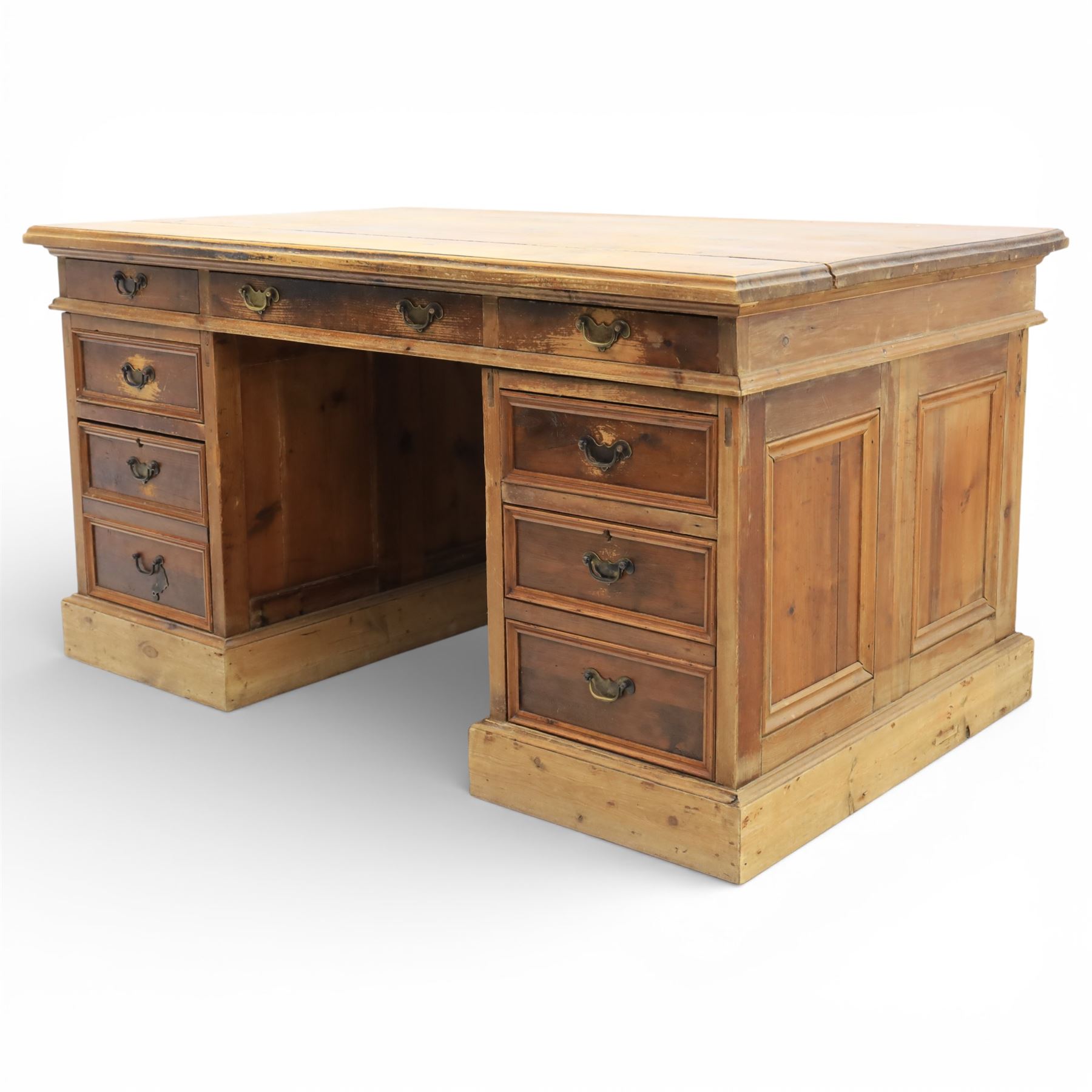Late 19th century Victorian pine twin pedestal desk, rectangular plank top above an arrangement of seven drawers with brass swan neck handles, each pedestal fitted with one drawer above a double height drawer, raised on plinth bases with panelled sides
